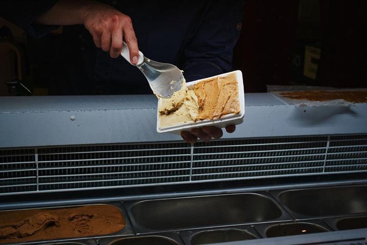 ice cream being served in a take away package